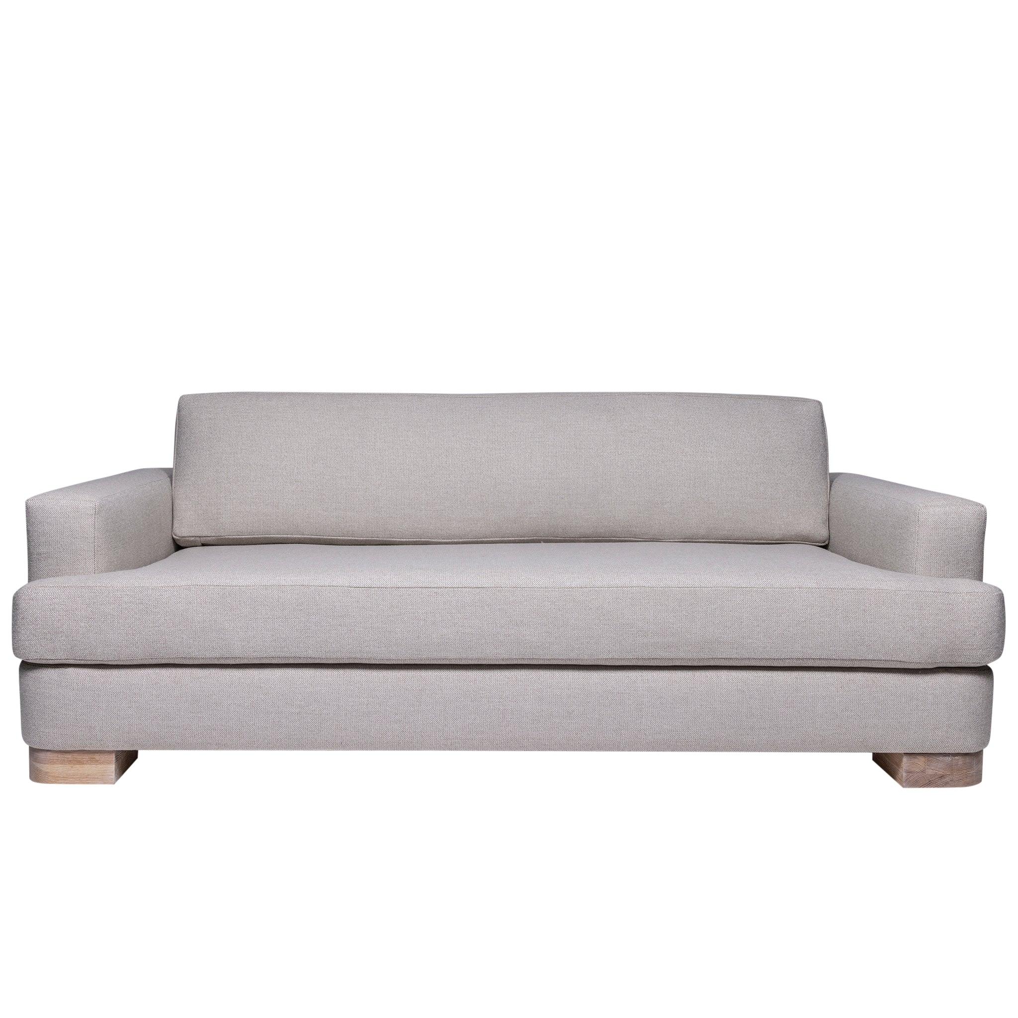 Ashley Yeates, renowned interior designer and sustainable leader, presenting the Alexandra Sofa, a signature design that exemplifies eco-friendly craftsmanship and modern elegance for sustainable living spaces