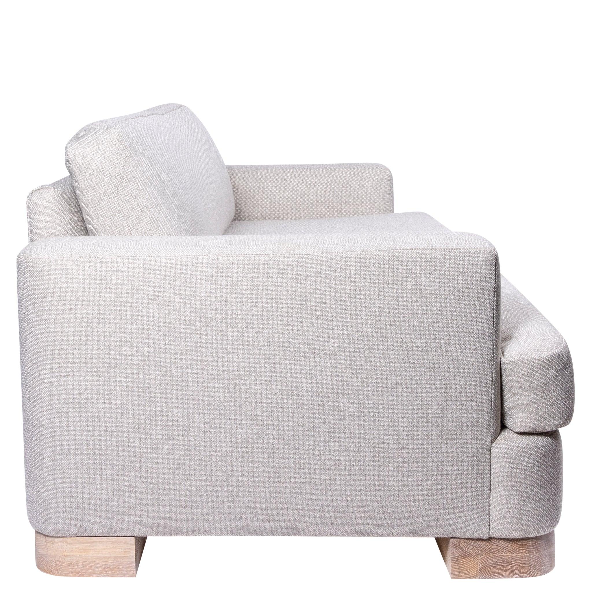 Ashley Yeates, renowned interior designer and sustainable leader, presenting the Alexandra Sofa, a signature design that exemplifies eco-friendly craftsmanship and modern elegance for sustainable living spaces