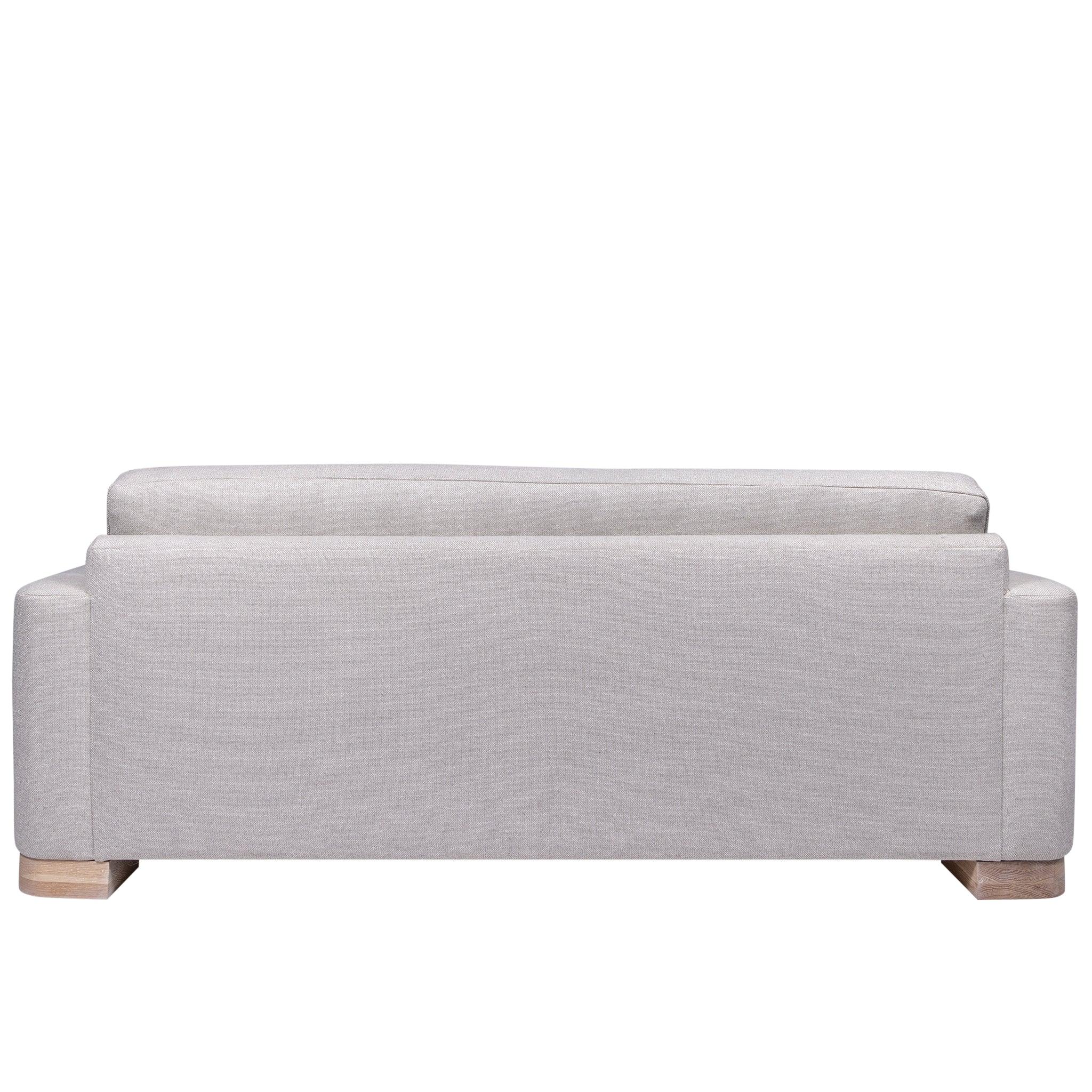 Ashley Yeates, renowned interior designer and sustainable leader, presenting the Alexandra Sofa, a signature design that exemplifies eco-friendly craftsmanship and modern elegance for sustainable living spaces