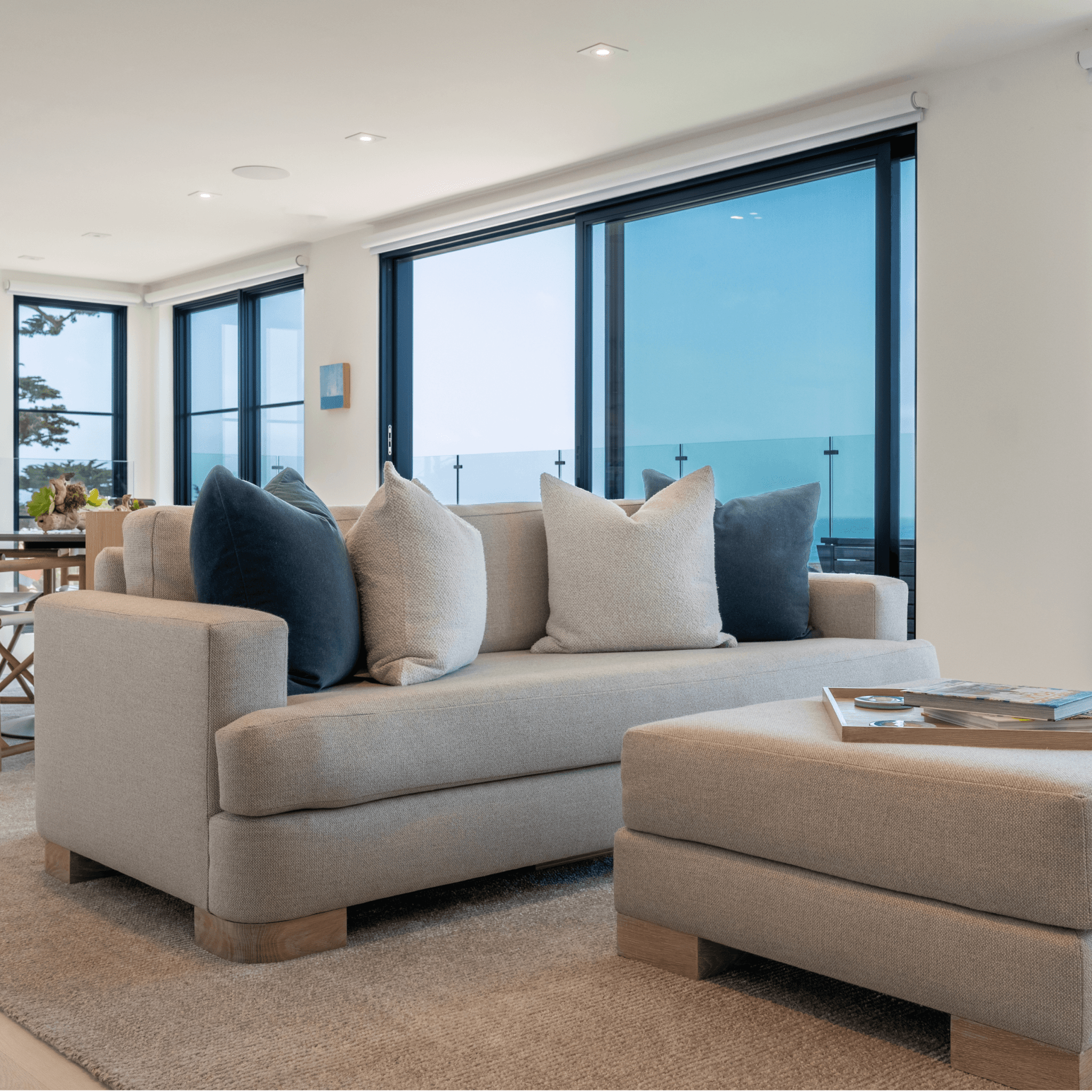 Ashley Yeates, sustainable design leader and interior designer, presenting the Alexandra Sofa, a stylish and eco-friendly furniture piece that exemplifies sustainable living and modern interior aesthetics