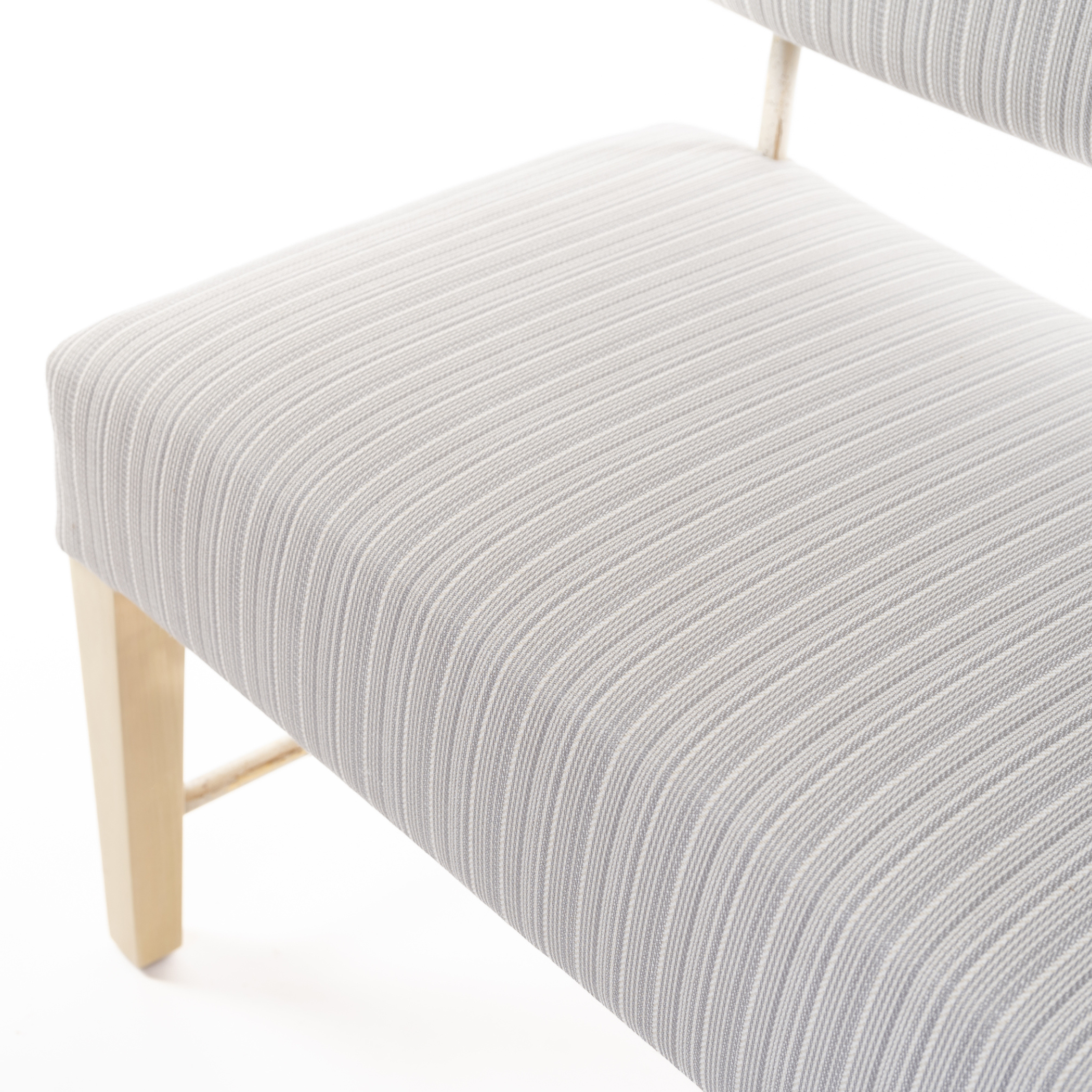 Ashley Yeates, interior designer and sustainable leader, presenting the Garland Bench, a signature design that combines elegance with eco-friendly materials, perfect for sustainable living spaces