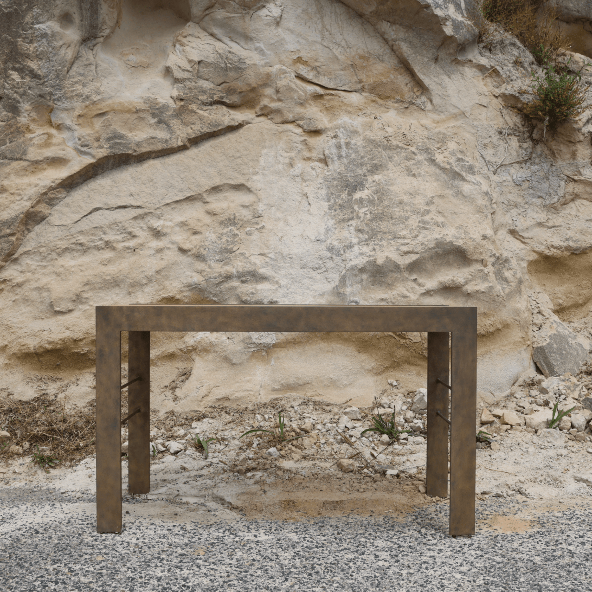 Ashley Yeates, sustainable interior design leader, with signature-designed Clift Console featuring a reclaimed wood top, exemplifying eco-friendly elegance for modern interiors