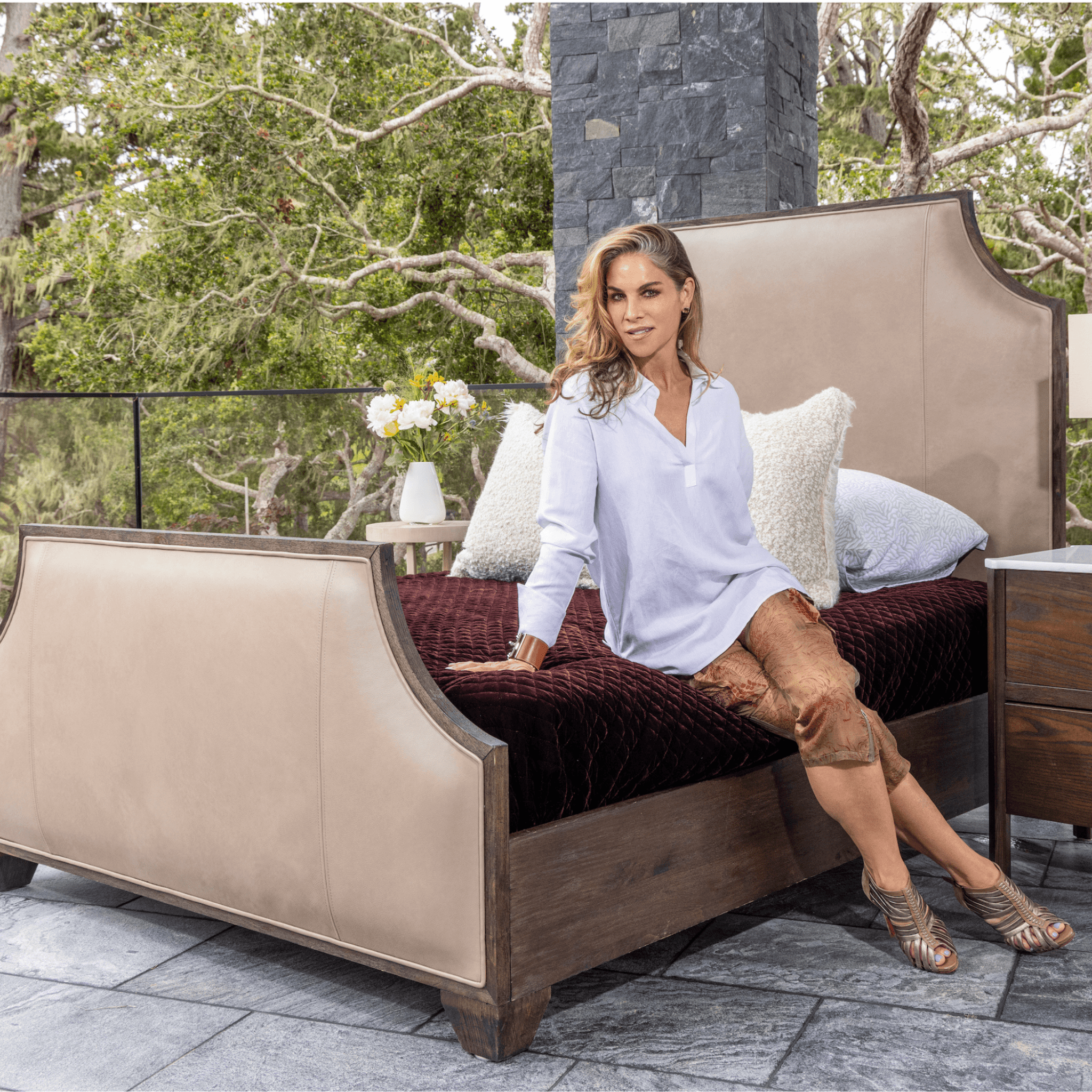 Ashley Yeates, renowned interior designer and sustainable leader, presenting the signature Kyle Bed, a stylish and eco-friendly furniture piece designed for modern living and sustainability