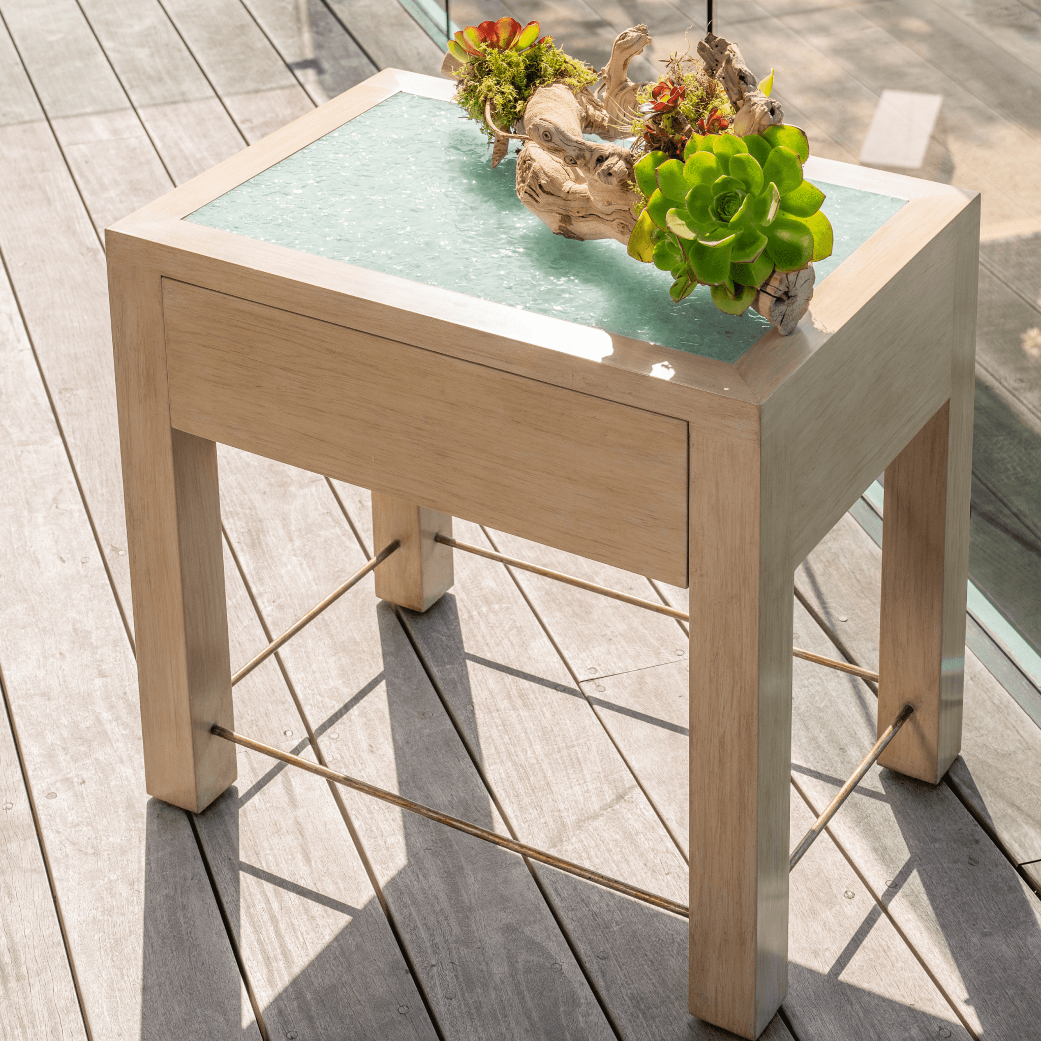 Ashley Yeates, sustainable interior design leader, showcasing the Misty Nightstand, a beautifully crafted piece made from eco-friendly materials, perfect for modern and sustainable home decor