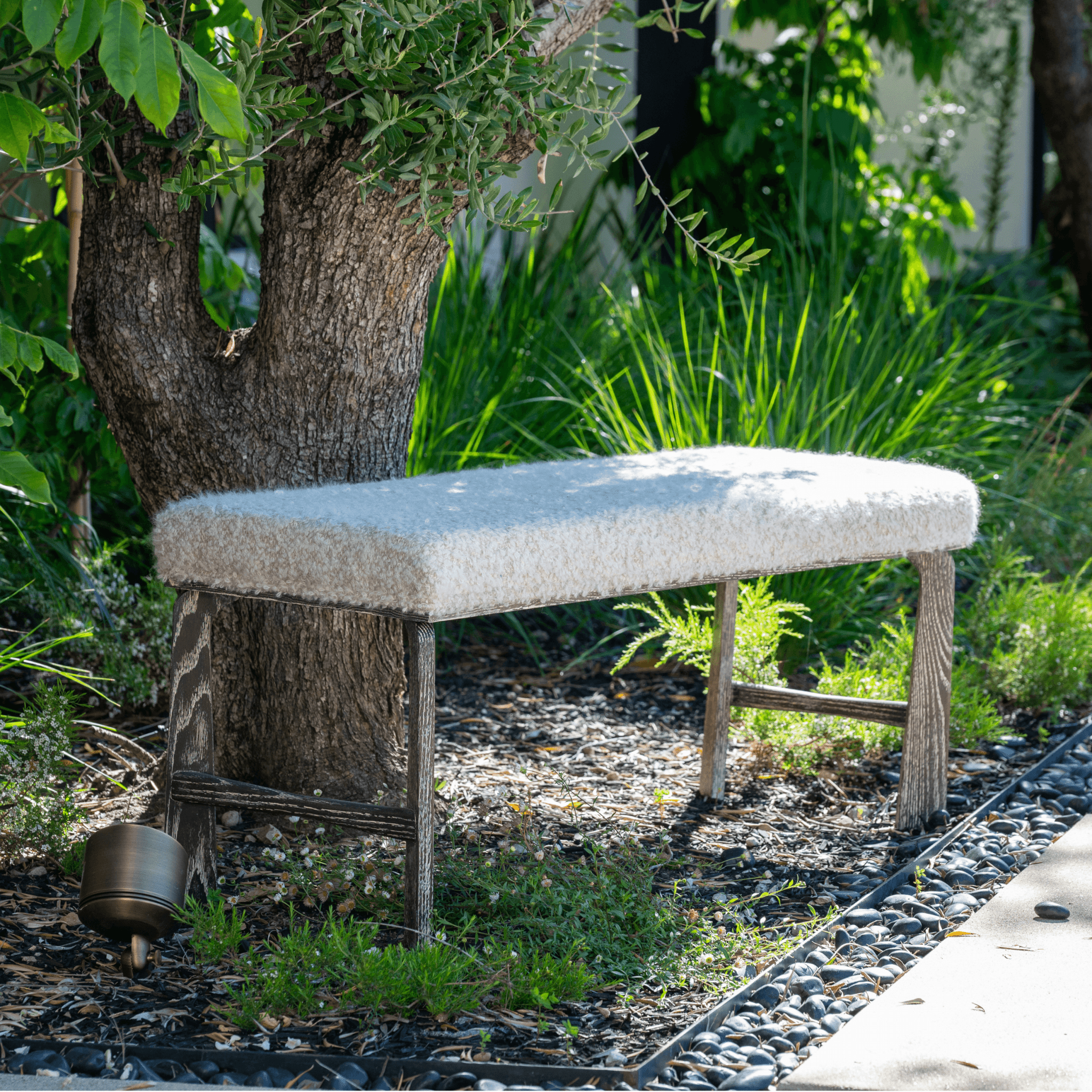 Ashley Yeates, renowned interior designer and sustainable leader, presenting her signature Astin Bench, a stylish and eco-friendly piece that exemplifies sustainable design in modern interiors